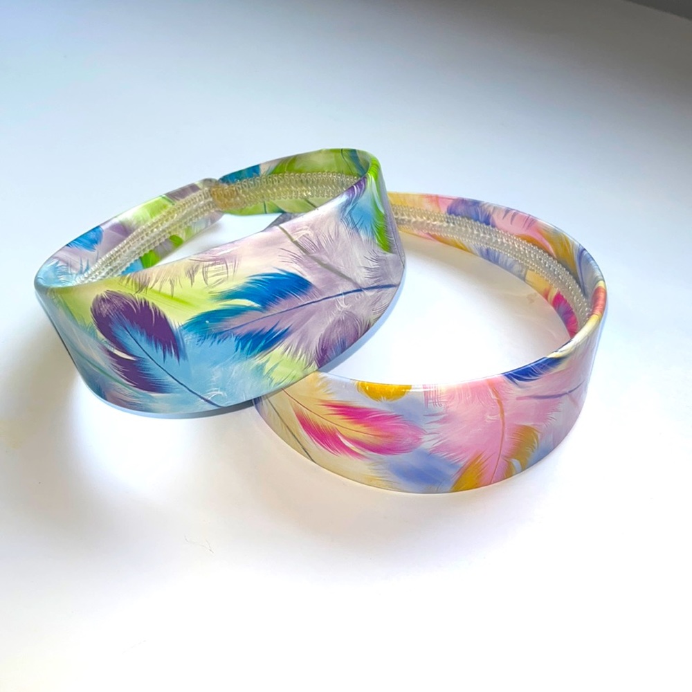 2 Girls hard headbands, feather patterns —Used in great condition